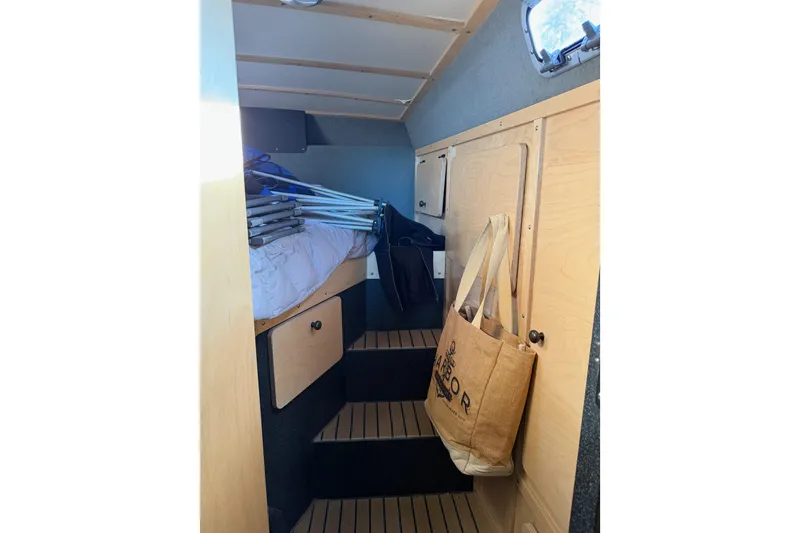 Slide: The Image of Interior of 2020 Armstrong Marine 35 boat with wooden storage compartments. - 56