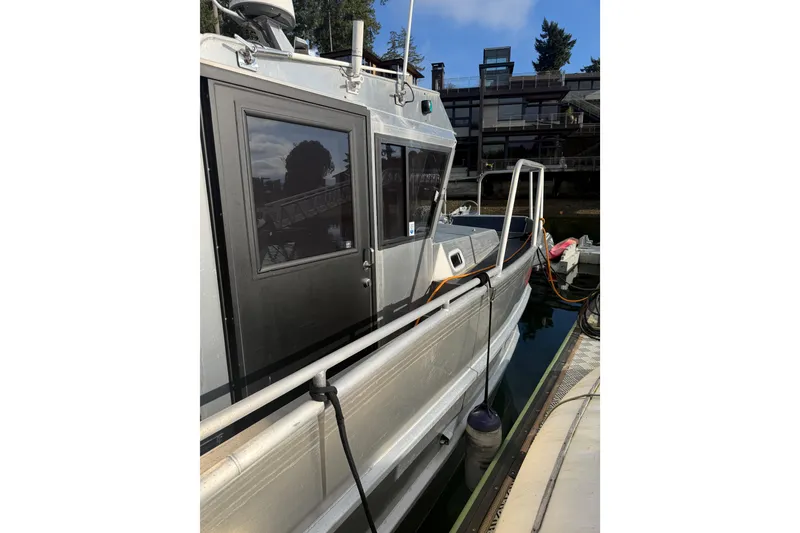 Slide: The Image of 2020 Armstrong Marine 35 boat with Yamaha outboard motor docked at marina. - 6