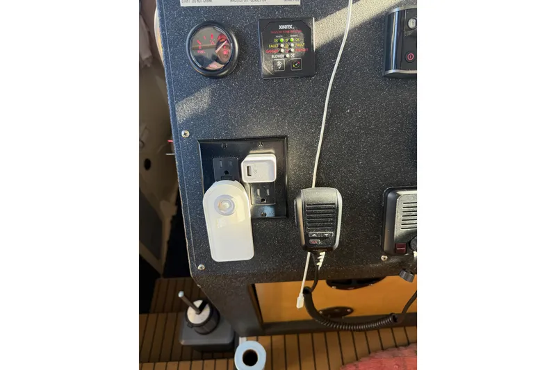 Slide: The Image of Control panel of a 2020 Armstrong Marine 35 boat with navigation and control systems. - 73