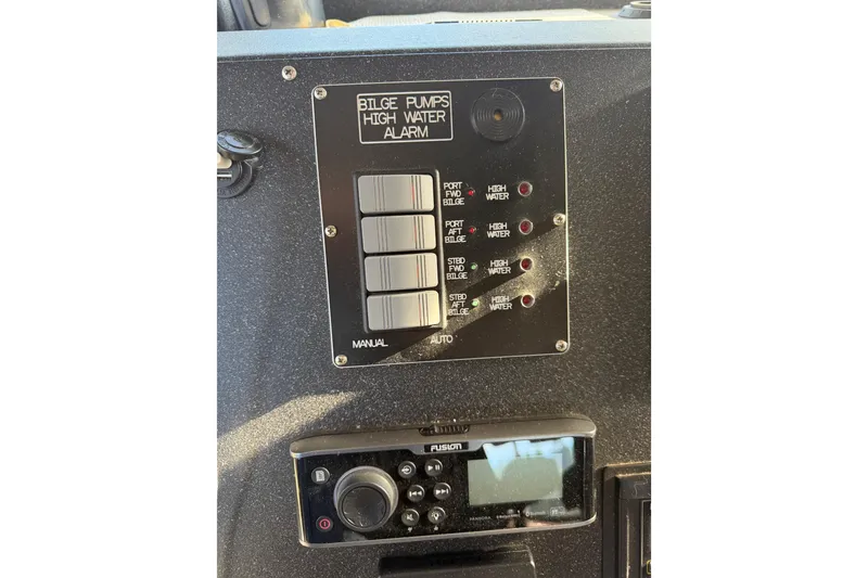 Slide: The Image of Control panel of 2020 Armstrong Marine 35 boat with Garmin device and switches. - 75