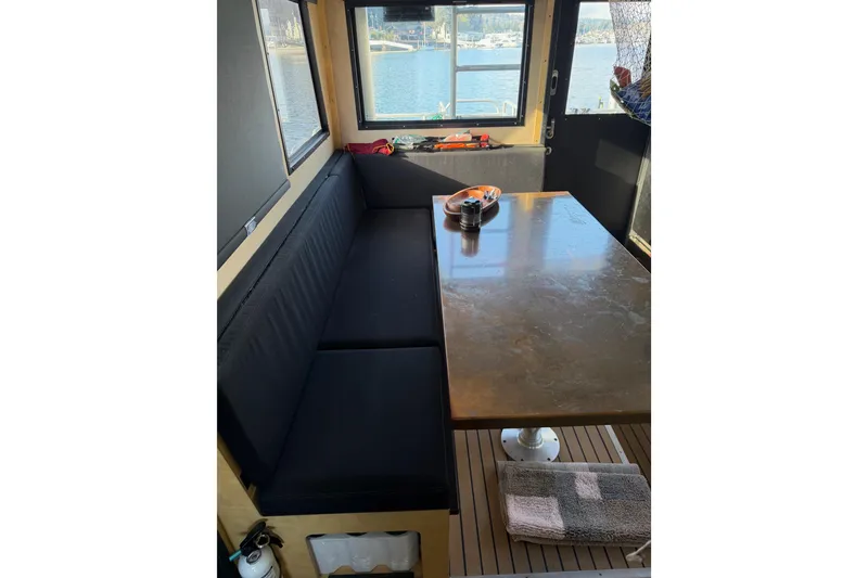 Slide: The Image of Modern kitchen sink area in 2020 Armstrong Marine 35 boat, featuring faucet and cleaning supplies. - 83