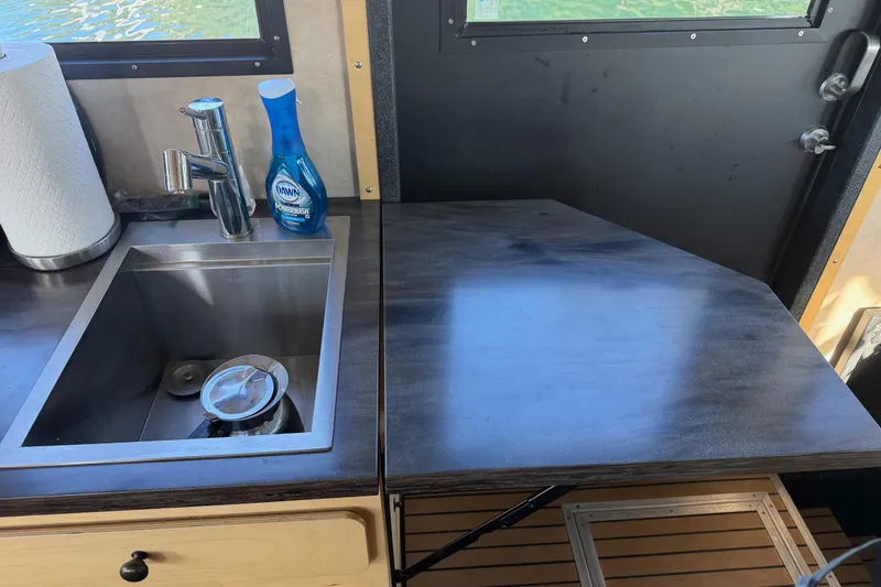 Slide: The Image of 2020 Armstrong Marine 35 boat docked in Gig Harbor, WA with American flag. - 89