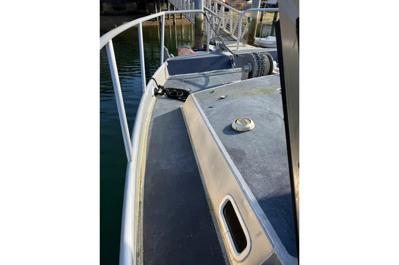 Slide: The Image of Interior of 2020 Armstrong Marine 35 boat with kitchen essentials and window view. - 91