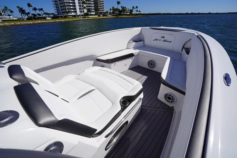 Slide: The Image of 2023 Nor-Tech 340 Sport Open Center Console boat interior with luxurious seating. - 21