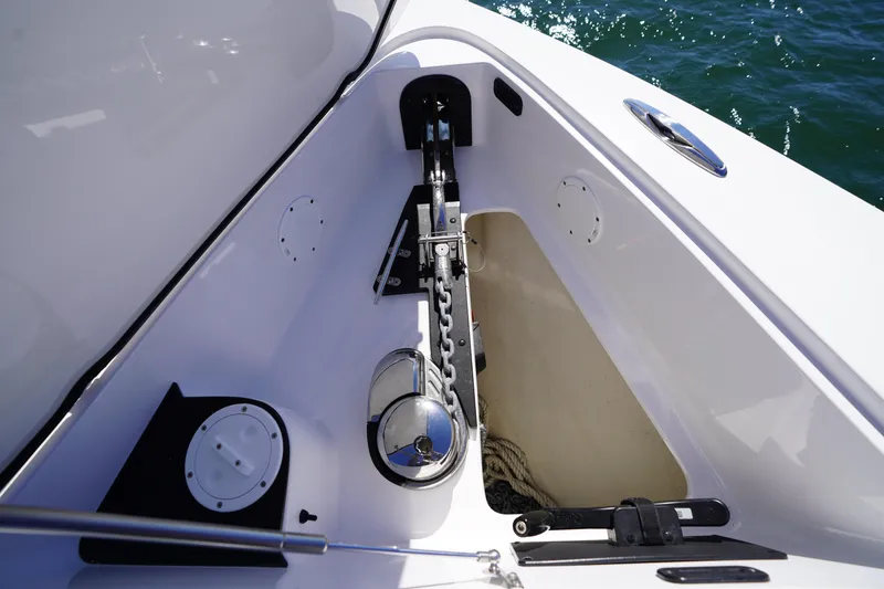 Slide: The Image of 2023 Nor-Tech 340 Sport Open Center Console anchor compartment detail. - 23