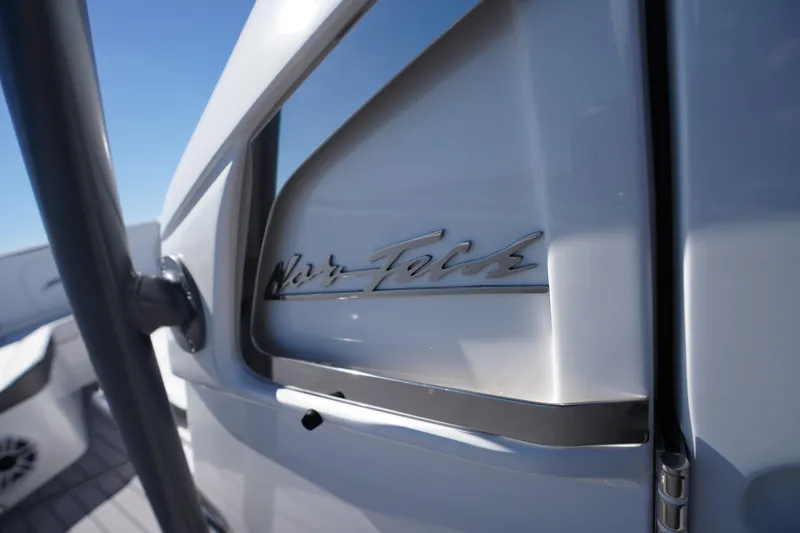 Slide: The Image of 2023 Nor-Tech 340 Sport Open Center Console boat detail with logo. - 25