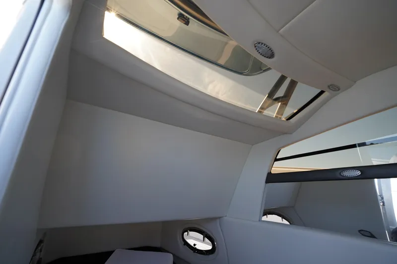 Slide: The Image of 2023 Nor-Tech 340 Sport Open Center Console interior with skylight and modern design. - 27