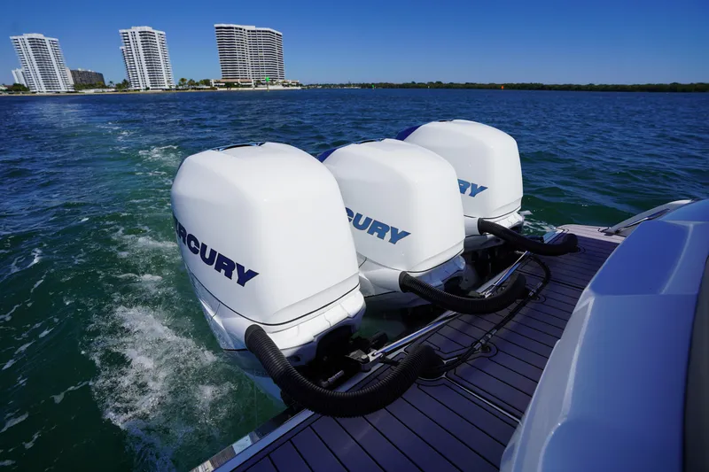Slide: The Image of 2023 Nor-Tech 340 Sport Open Center Console with triple Mercury engines on water. - 28