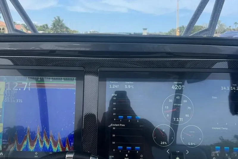 Slide: The Image of 2023 Nor-Tech 340 Sport Open Center Console with luxurious seating and waterfront view. - 7