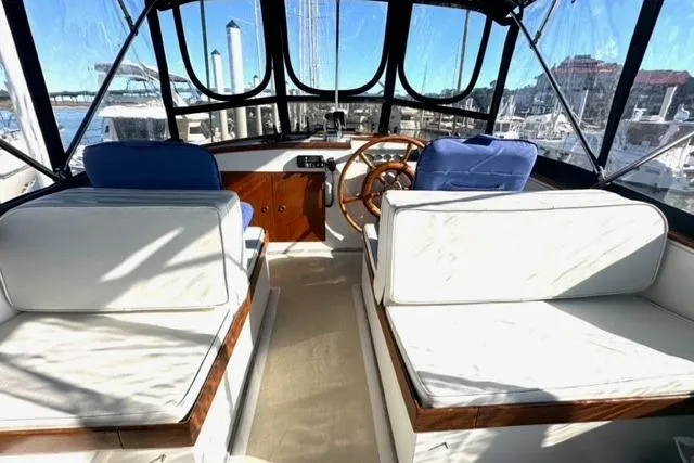 Slide: The Image of Interior view of 1981 Grand Banks 36 Classic yacht with seating and steering wheel. - 13