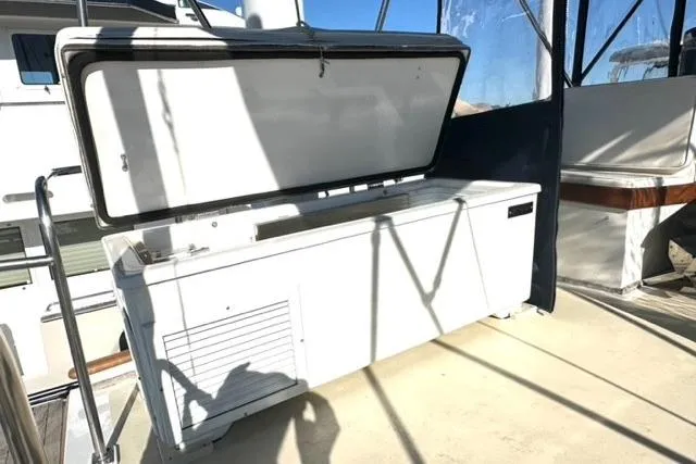 Slide: The Image of 1981 Grand Banks 36 Classic boat deck with open storage compartment. - 14