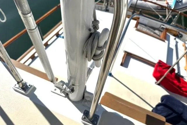 Slide: The Image of 1981 Grand Banks 36 Classic deck with railing and coiled rope detail. - 16