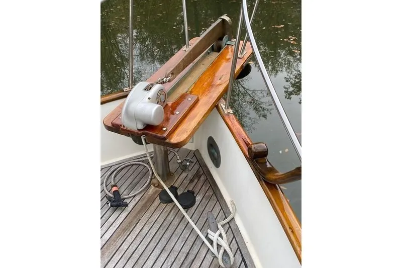 Slide: The Image of 1981 Grand Banks 36 Classic boat deck with winch and wooden railings. - 19