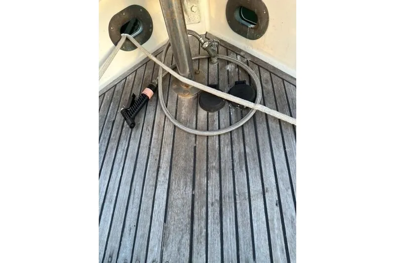 Slide: The Image of 1981 Grand Banks 36 Classic boat deck with ropes and fittings. - 20