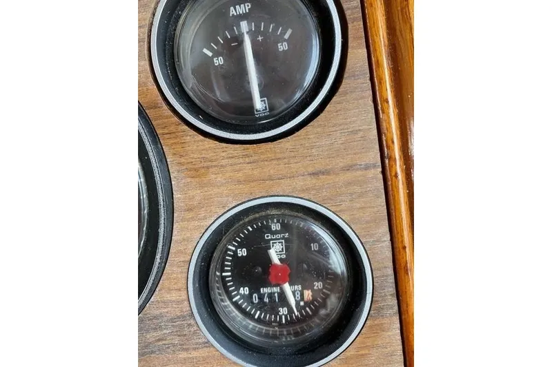 Slide: The Image of Close-up of 1981 Grand Banks 36 Classic boat gauges on wooden panel. - 26