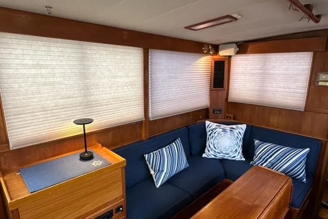 Slide: The Image of Interior of 1981 Grand Banks 36 Classic yacht with cozy seating and nautical decor. - 27