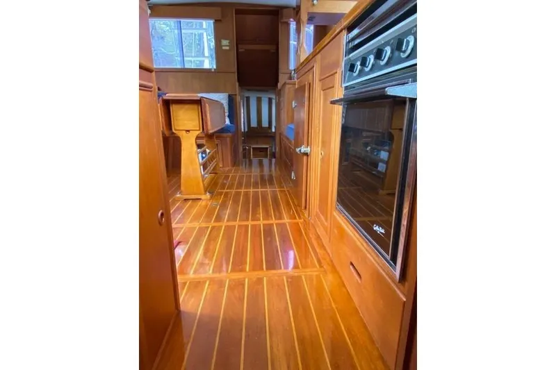 Slide: The Image of Interior of 1981 Grand Banks 36 Classic yacht with wooden flooring and cabinetry. - 33