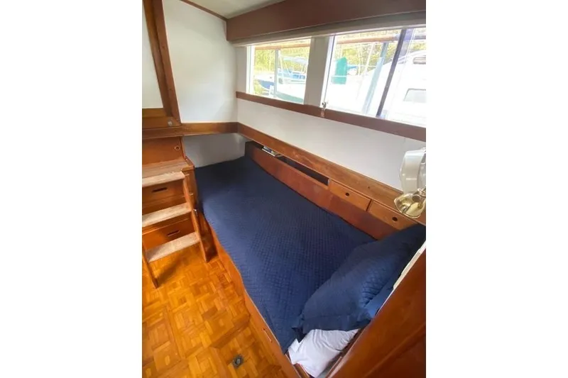 Slide: The Image of Cozy cabin interior of 1981 Grand Banks 36 Classic yacht with wooden furnishings. - 35