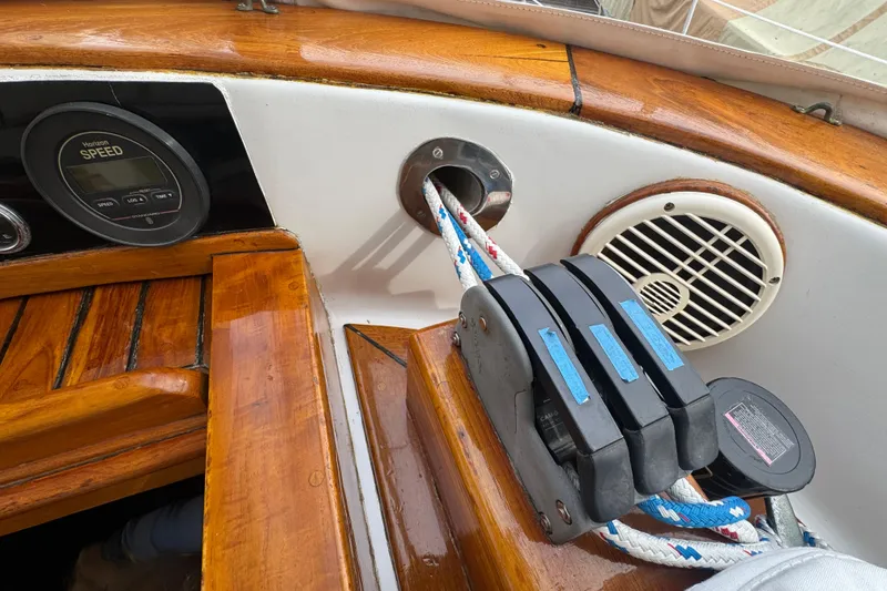 Slide: The Image of View from a 1978 Robert Perry 47 sailboat docked in a marina with other boats. - 16