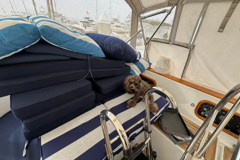 Slide: The Image of Dashboard of a 1978 Robert Perry 47 yacht with wooden finish and navigation instruments. - 18