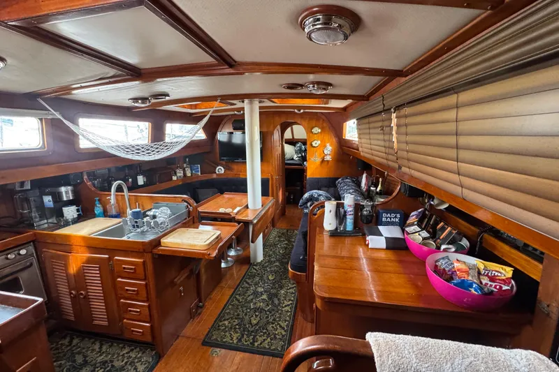 Slide: The Image of Control panel of a 1978 Robert Perry 47 yacht with gauges and oil discharge notice. - 28