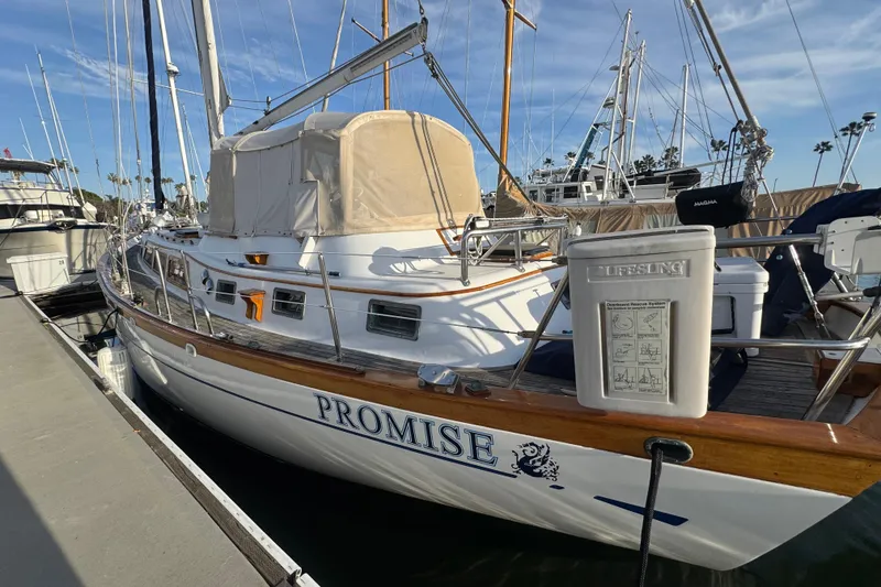Slide: The Image of Sailboat "Promise" docked, Robert Perry 47 model, 1978, with lifebuoy system visible. - 39
