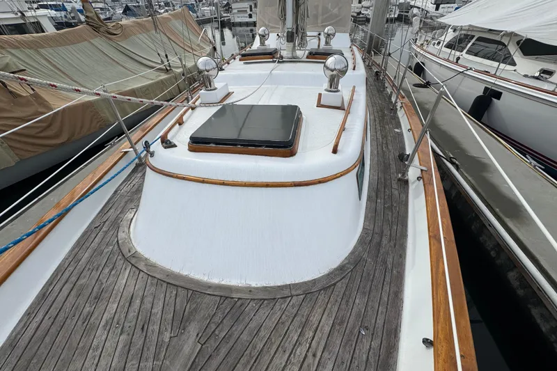 Slide: The Image of Sailboat "Promise" by Robert Perry, model 47, 1978, docked in water. - 7