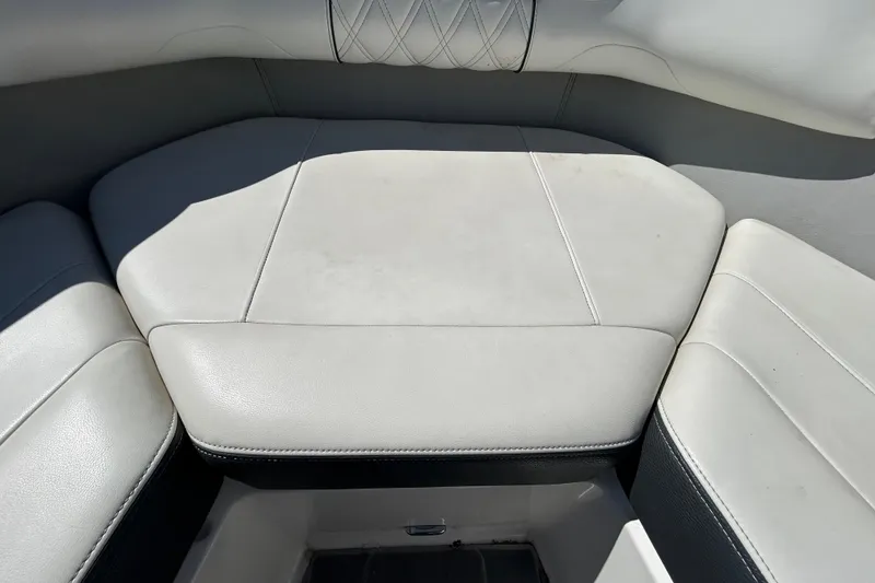 Slide: The Image of 2022 Regal LS2 boat interior seating with white upholstery and diamond stitching. - 107