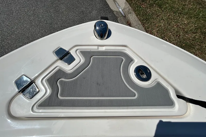 Slide: The Image of Bow of 2022 Regal LS2 boat with anchor storage and chrome fittings. - 111