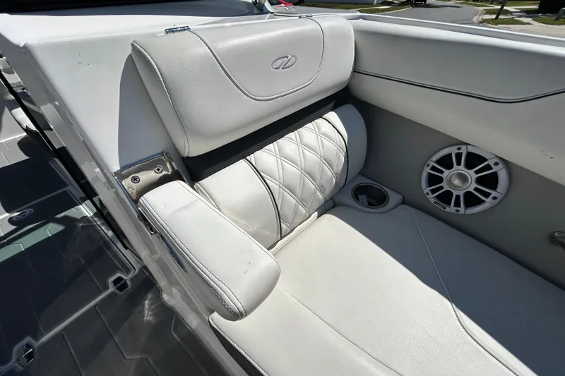 Slide: The Image of 2022 Regal LS2 boat interior with white leather seating and speaker detail. - 118