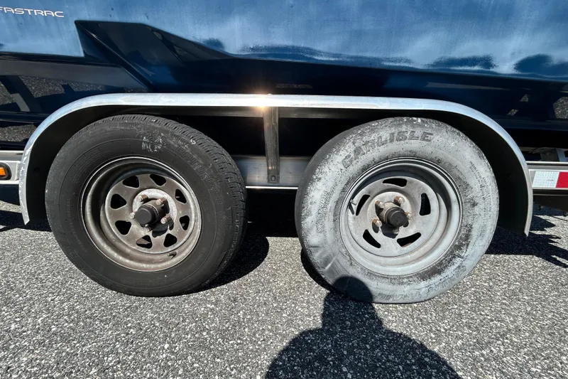 Slide: The Image of Trailer with two wheels, one flat, on a Regal LS2, 2022 model. - 122