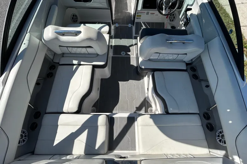Slide: The Image of 2022 Regal LS2 boat interior with luxurious seating and modern design. - 22