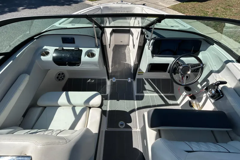 Slide: The Image of 2022 Regal LS2 boat interior with modern dashboard and seating. - 27