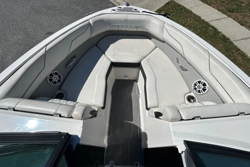 Slide: The Image of 2022 Regal LS2 boat interior with white seating and speakers. - 29