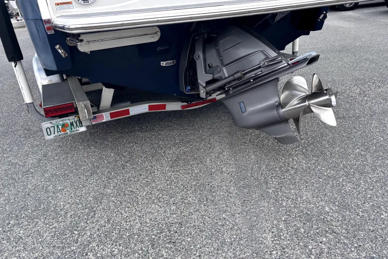 Slide: The Image of 2022 Regal LS2 boat with dual propeller and Florida license plate. - 3