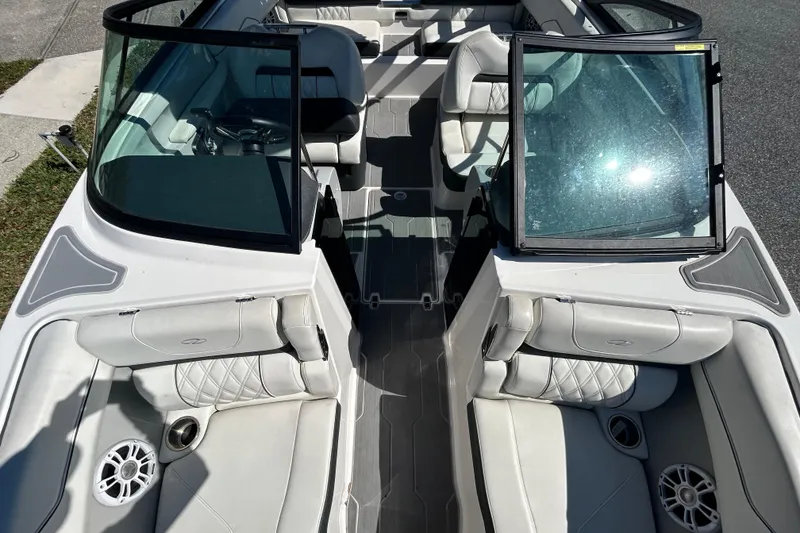 Slide: The Image of 2022 Regal LS2 boat interior with white seating and open windshield. - 33