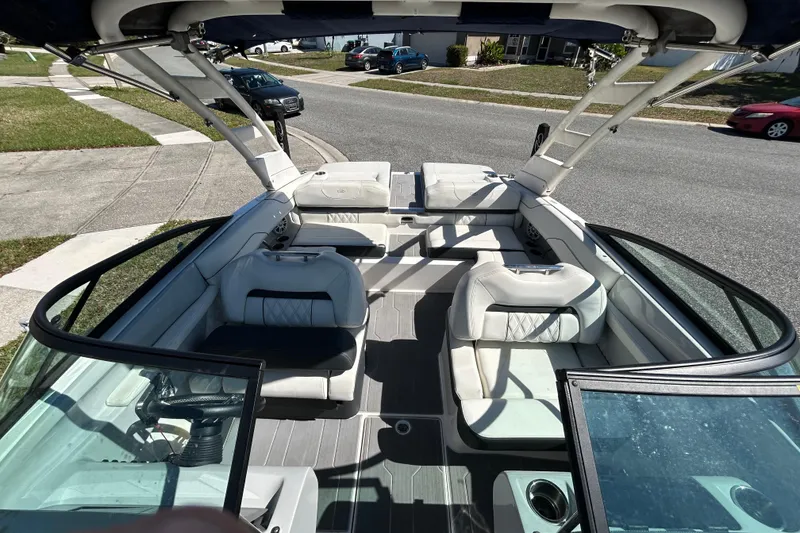 Slide: The Image of Interior view of a 2022 Regal LS2 boat with luxurious seating and modern design. - 36