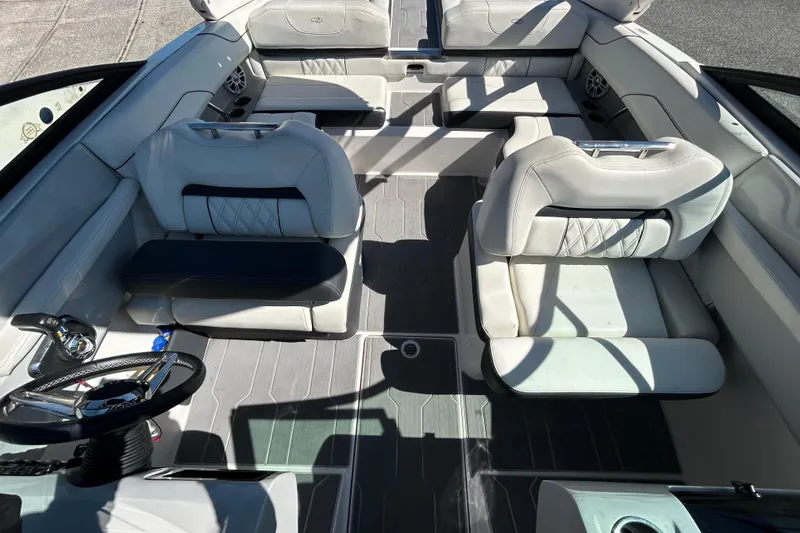 Slide: The Image of Luxurious interior of a 2022 Regal LS2 boat with plush seating and modern design. - 37