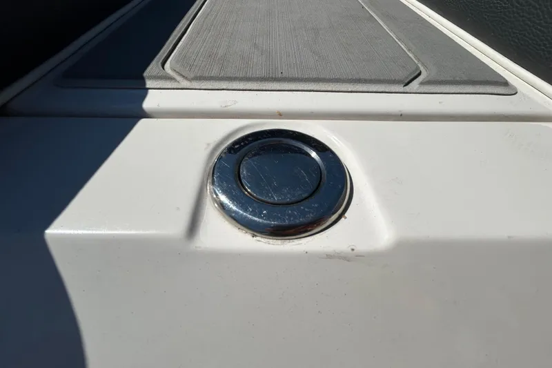 Slide: The Image of 2022 Regal LS2 boat detail with chrome button on white surface. - 46