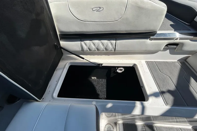 Slide: The Image of Open storage compartment in 2022 Regal LS2 boat interior. - 57