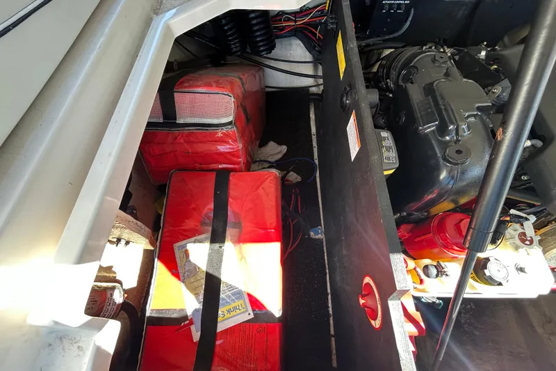 Slide: The Image of Engine compartment of a 2022 Regal LS2 boat with safety equipment and wiring. - 62