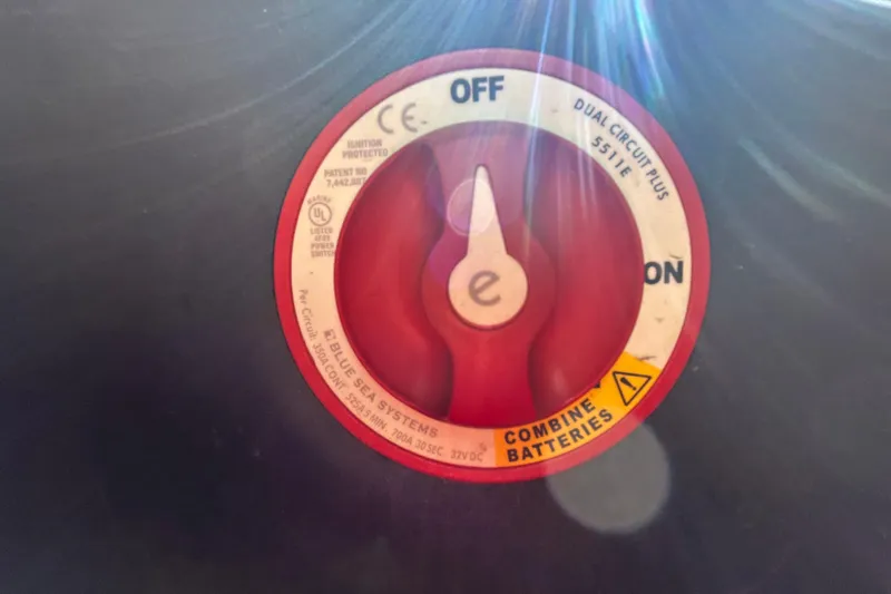 Slide: The Image of Red battery switch labeled "Blue Sea Systems" on a 2022 Regal LS2. - 64