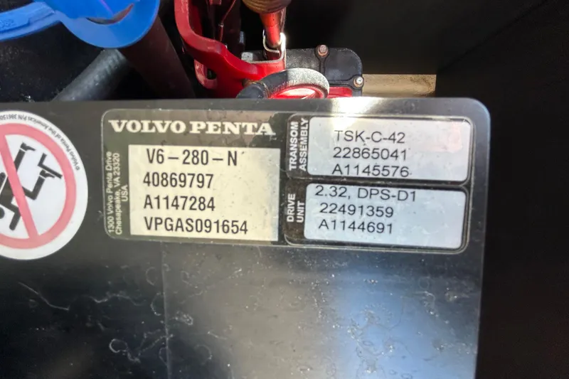 Slide: The Image of Volvo Penta engine label with specifications and serial numbers on a Regal LS2 2022. - 67