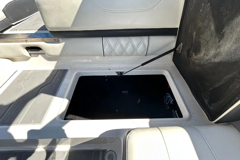 Slide: The Image of Open storage compartment in a 2022 Regal LS2 boat interior. - 69