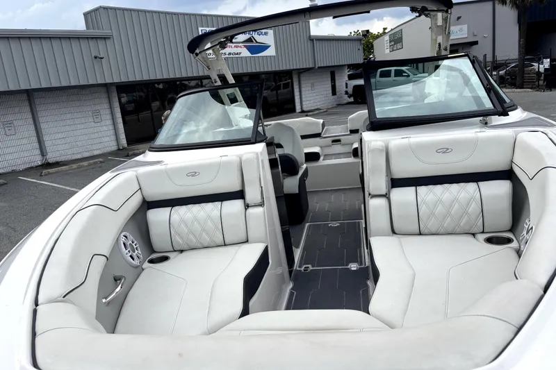 Slide: The Image of 2022 Regal LS2 boat interior with white leather seating and modern design. - 8