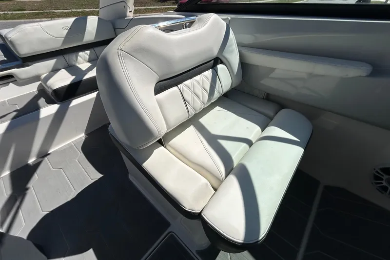 Slide: The Image of Luxurious white seating in 2022 Regal LS2 boat interior. - 80