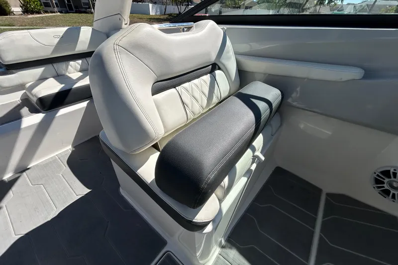 Slide: The Image of 2022 Regal LS2 boat interior with white and black seating. - 82