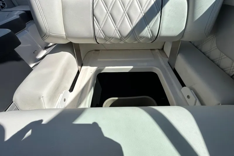 Slide: The Image of 2022 Regal LS2 boat seat storage compartment with quilted upholstery. - 84