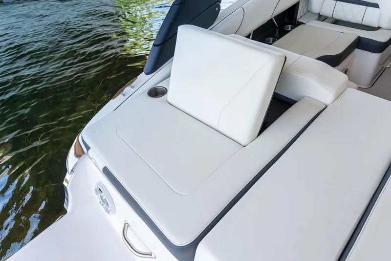Slide: The Image of Manufacturer Provided Image: 2022 Regal LS2 boat with white leather seating near water. - 9