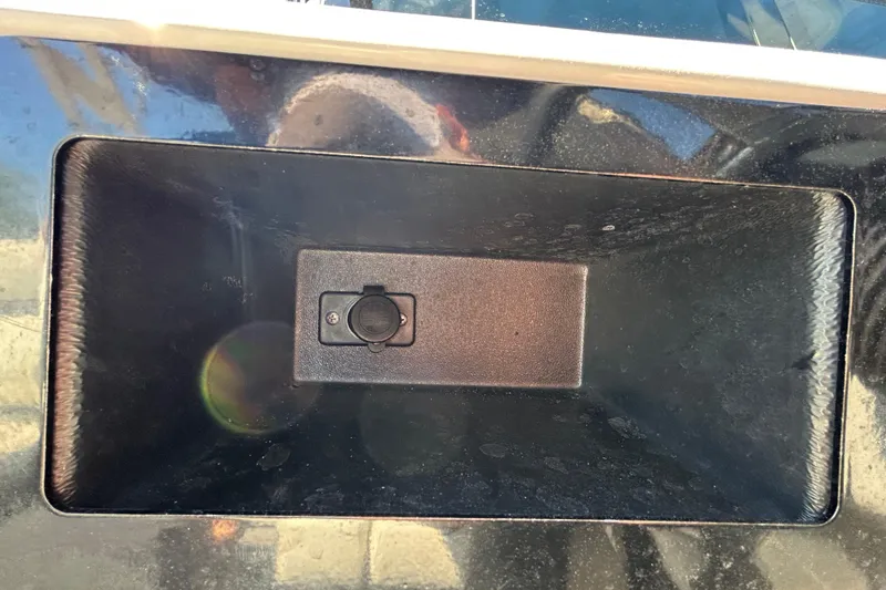 Slide: The Image of Close-up of a 2022 Regal LS2 boat's recessed power outlet. - 90